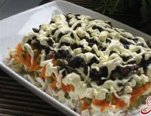 Salad with chicken, prunes, cucumber and cheese